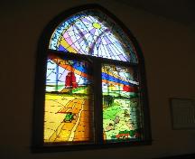 Unique stained glass window depicting four typical prairie scenes, 2004.; Government of Saskatchewan, Jennifer Bisson, 2004.