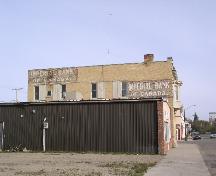View of south façade, showing original bank signage, 2003.; Government of Saskatchewan, Jennifer Bisson, 2003.