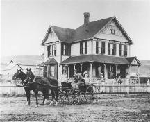 William Cousins house (Sunnyholme) with family members pictured about the yard in front (circa 1900); Esplanade Archives, Medicine Hat, Image 0017.0010