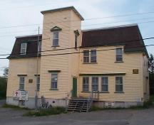 View of front and right facades, St. George's Court House, St. George's, NL, prior to restoration in 2004, showing missing tower roof.; HFNL 2005