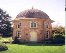 View of the peacock house from the north showing main entrance – June 2003; OHT, 2003