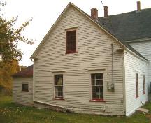 Rear elevation, Campbell Heritage House, Strathlorne, Nova Scotia, 2004. This section of the house is thought to be older than the front, Gothic section. Note the window trim and eave returns.
; Heritage Division, NS Dept. of Tourism, Culture and Heritage, 2004.