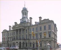 Corner view of the Victoria Hall / Cobourg Town Hall, showing the front elevation and the central, temple-fronted pavilion, 1990.; Parks Canada Agency / Agence Parcs Canada, 1990.