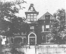 Allison House front facade showing original tower and porch, late 19th century.; Queen's University Archives