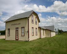View, from the southwest, of the Strathclair Museum (consisting of the M and NW Railway Station and St. George's Anglican Church), Strathclair, 2005; Historic Resources Branch, Manitoba Culture, Heritage, Tourism and Sport, 2005