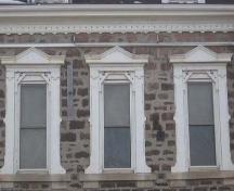 Second floor windows exhibiting side brackets and decorated surmounts, 2007.; Lindsay Benjamin, 2007.