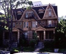 Two-and-a-half storey, buff-coloured brick double residence built 1906; City of Ottawa 2005