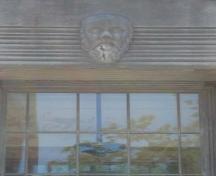 Featured is the Socrates mask over the front door of the Elsie Perrin Williams Memorial Library.; Kendra Green, 2007.