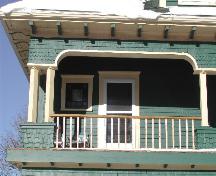 This photograph shows the upper storey of the verandah and the exposed rafter tails under the eaves, 2005; City of Saint John
