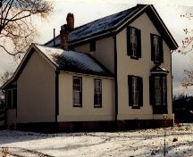 Rear view of Bell Homestead, showing its stucco finish, 1997.; Parks Canada Agency / Agence Parcs Canada, James De Jonge, 1997.