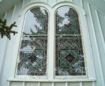 Window detail, east elevation, St. Peter's and St. John's, Baddeck, Nova Scotia, 2004.
; Heritage Division, NS Dept. of Tourism, Culture and Heritage, 2004.