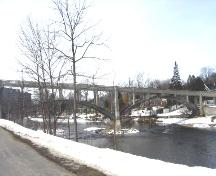 View of the bridge looking north from the walking trail beside Woolwich Street.; Mary Tivy, 2008.