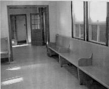 Public waiting room, showing the original wooden benches, 1999.; Parks Canada Agency/ Agence Parcs Canada, 1999.