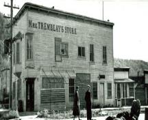Corner view of Mme. Tremblay's Store, showing the projecting lettering spelling out the name “Mme Tremblay’s Store”, 1948.; Library and Archives Canada / Bibliothèque et Archives Canada, 1948.