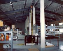 General view of the Warehouse and Office, showing its open, well-lit interior, 1990.; Parks Canada Agency / Agence Parcs Canada, 1990.