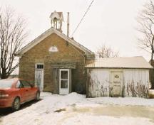 View of the main entrance of Former Mount Pleasant School House, showing its simple aesthetic design, scale, and solid, well-built appearance, 2005.; Department of Public Works and Government Services / Ministère des Travaux publics et services gouvernementaux, Alice Da Silva, 2005.