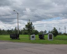 General view of the Historical Sites and Monuments Board of Canada's plaques on the empty field near where the entrances to the mines stood commemorating the Springhill Coal Mining site, 2010.; Parks Canada Agency / Agence Parcs Canada, 2010