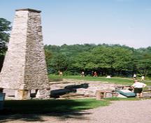View of the chimney and remains of the lower forge at Forges du Saint-Maurice National Historic Site of Canada, 2002.; Parks Canada Agency / Agence Parcs Canada, E. Kedl, 2002.