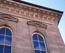 Detailed view of Guelph City Hall, showing its Italianate detailing, including quoins at openings and corners, 1995.; Parks Canada Agency/Agence Parcs Canada, J. Butterill, 1995.