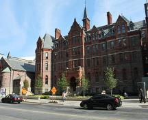 General view of Royal Conservatory of Music, showing the balanced, four-storey massing and detailing that exhibits High Victorian Gothic Revival, Queen Anne Revival and Romanesque elements, 2010.; Royal Conservatory of Music, Joseph A, August 2010.