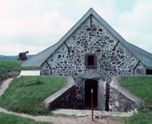 Facade of the South Powder Magazine showing the single square headed door, 1994.; Parks Canada/ Parcs Canada. Jérôme, J.P, 1994.