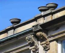 Detail of a Granville Block building, showing the Italianate design element of the ornate moldings on the eaves, 2005.; Parks Canada Agency / Agence Parcs Canada, 2005.