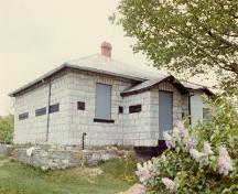 General view of the west façade of the Defensible Lockmaster’s House, 1987.; Parks Canada Agency / Agence Parcs Canada, 1987.