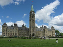 General view of the façade of Centre Block emphasizing the whole of its exterior, centred on the Peace Tower, 2010.; Parks Canada| Parcs Canada