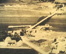 Historic photo showing the Brait estate in the lower left and its location overlooking the Rexton bridge.; Village of Rexton