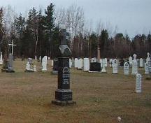 Older section of the cemetery of the Church of the Immaculate Conception.; Village of Rexton