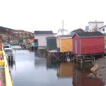 View of Fortune Fishing Sheds, Fortune, NL from entrance to Community Wharf. Photo taken April 2006. ; HFNL/Andrea O'Brien 2006
