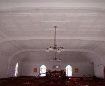 Interior photo view of of Heyfield Memorial United Church, from rear, facing altar, showing decorative tin on ceiling and walls, 2007/01/10; L Maynard, HFNL 2007
