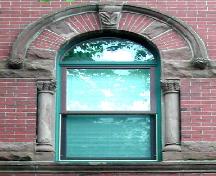 This photograph shows the second storey, Roman arched center window, 2006. ; City of Saint John