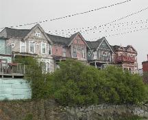 This photograph shows the contextual view of the four unit complex, 2005; City of Saint John