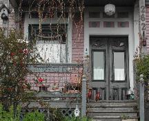 This photograph shows the paired wooden doors and the porch, 2005.; City of Saint John