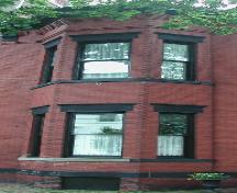 This image provides a view of the two-storey, semi-octagonal bay windows, 2005.; City of Saint John