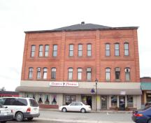 Image of the front façade of the building, taken from the north.; Carleton County Historical Society