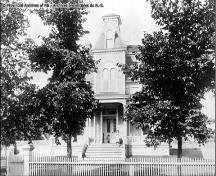 Residence of C. D. Manny (later the Anderson Residence), a young Louise Manny and her dog in the photo.; Provincial Archives of New Brunswick
