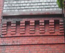 This image provides a view of the brick corbel bands along the cornice, 2005.; City of Saint John