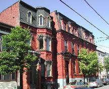 This photograph shows the boarding house in the forefront, 2005.; City of Saint John