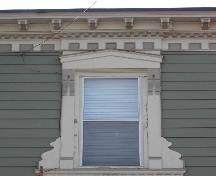 This image provides a view of the cornice supported by decorative brackets, 2005. ; City of Saint John