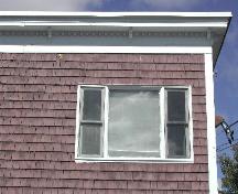 This photograph shows the large cornice, decorated with dentils and brackets, 2005.; City of Saint John