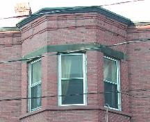 This image provides a view of the cornice ornamented by corbel bands above bay windows, 2005.
; City of Saint John