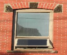 This image provides a view of a segmented arched window opening, 2005.; City of Saint John
