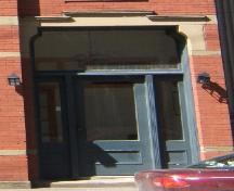 This photograph shows the entrance with its large transom window, 2005; City of Saint John