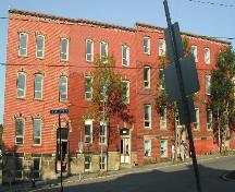 This photograph is a contextual view of the building on Charlotte Street. This residence is the unit on the left side of the image. 2005.; City of Saint John