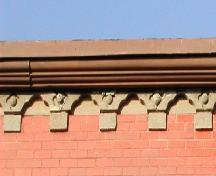 This photo shows the cornice with sandstone brackets, 2005.; City of Saint John