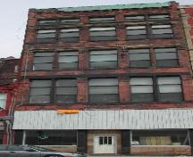 This photograph shows the contextual view of the Water Street façade, 2005.; City of Saint John