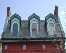 This photograph shows the cornice and the three dormer windows, 2005.; City of Saint John