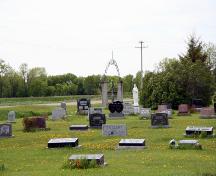 Contextual view, from the southeast, of the cemetery grounds and gate at the Fredensthal Lutheran Cemetery section of the Fredensthal Lutheran Cemeteries, Emerson area, 2007; Historic Resources Branch, Manitoba Culture, Heritage, Tourism and Sport, 2007